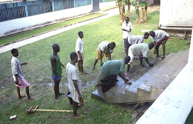 Students cleaning the steps of the Ghana Bible College - October 2000